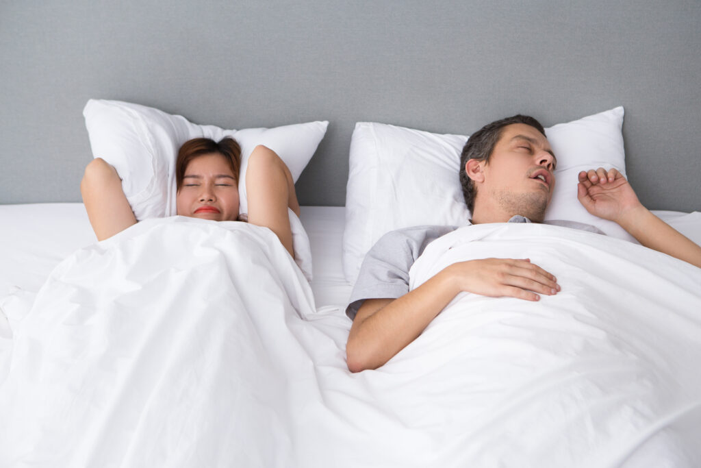 How to Sleep Next To Someone Who Snores